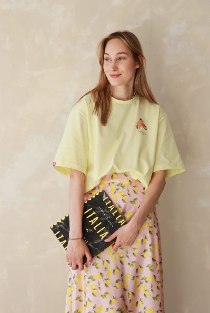 Koszulka oversize unisex z motywem cannoli – pastelowa żółć w roli głównej
