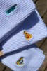 Zestaw białych skarpetek podróżniczych unisex NOWY JORK USA z kultowymi statua wolności taxi one dollar pizza podróże